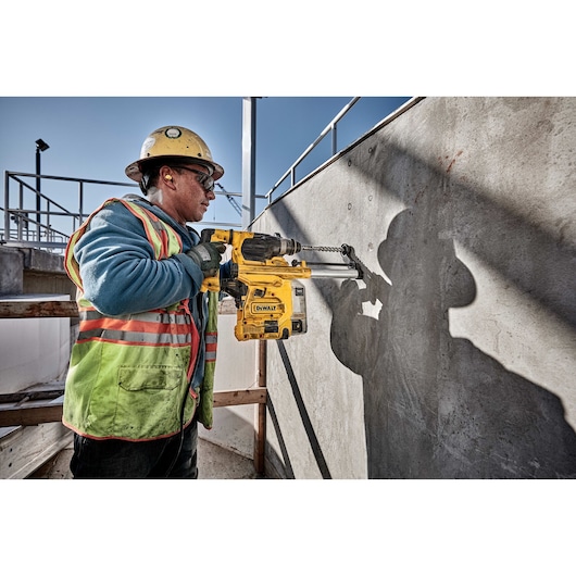 Profile of SDS Plus rotary hammer being used by person