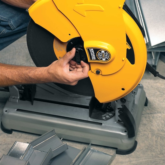 Blade of Chop Saw with QUIK-CHANGE keyless blade change system being removed