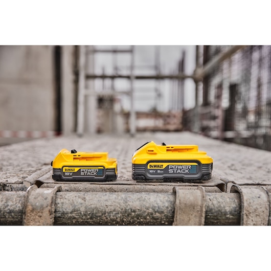 18V XR POWERSTACK 5Ah Battery right side view with standard 18V battery on scaffolding