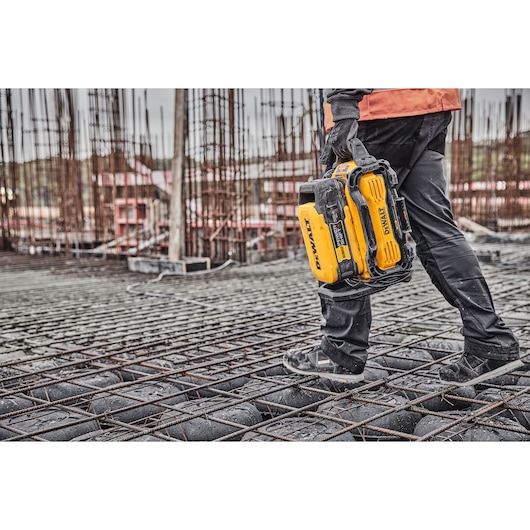 Powershift 554WH battery being carried by a construction worker