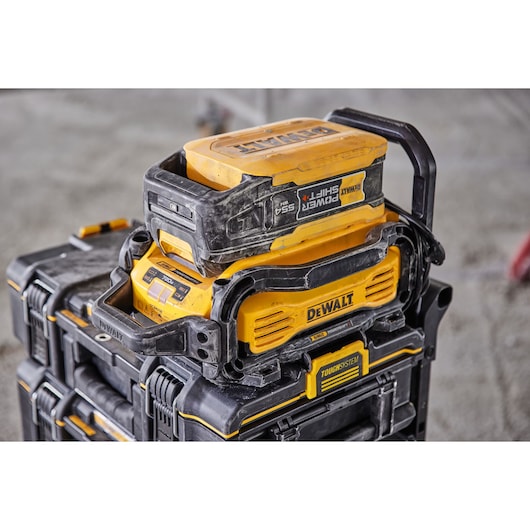 Powershift 554WH battery and Powershift charger DCBPSC0550 stacked on top of ToughSystem storage