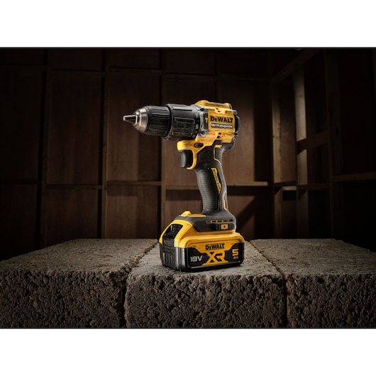 The limited edition 18V Brushless 100 year Hammer Drill Driver sitting on concrete blocks