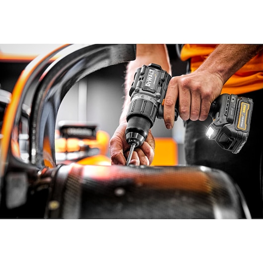 Limited Editon DEWALT/McLaren Drill Driver being used on McLaren F1 carbon fibre wheel  