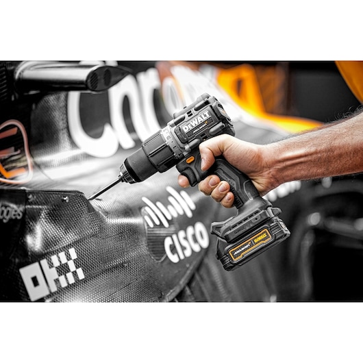 Close view of Limited Editon DEWALT/McLaren Drill Driver being on McLaren F1 car