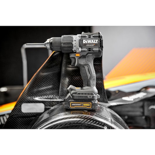 Limited Editon DEWALT/McLaren Drill Driver sitting on top of McLaren F1 car