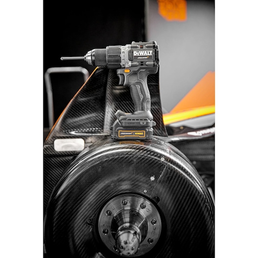 Limited Editon DEWALT/McLaren Drill Driver sitting on top of McLaren F1 carbon fibre wheel  