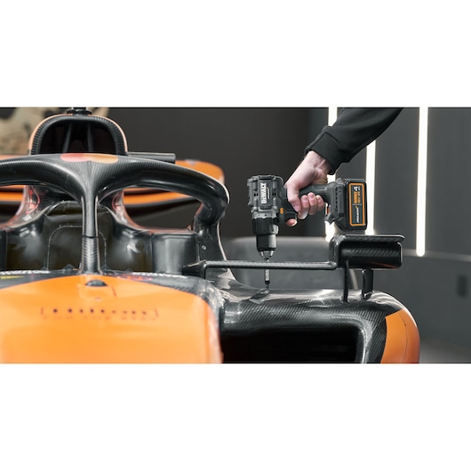 DEWALT/McLaren drill driver being used on McLaren racing car