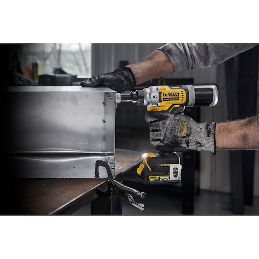 18V XR BRUSHLESS 6.4mm Rivet Tool being used on HVAC unit