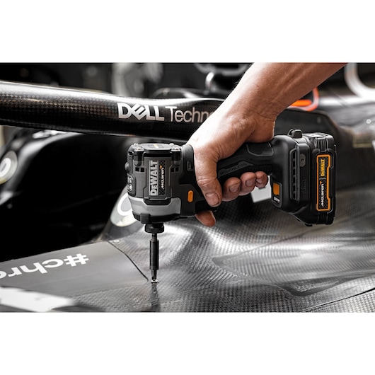 Limited Editon DEWALT/McLaren Impact Driver being used in McLaren garage on car chassis