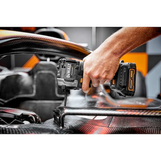 Limited Editon DEWALT/McLaren Impact Driver being used on car chassis