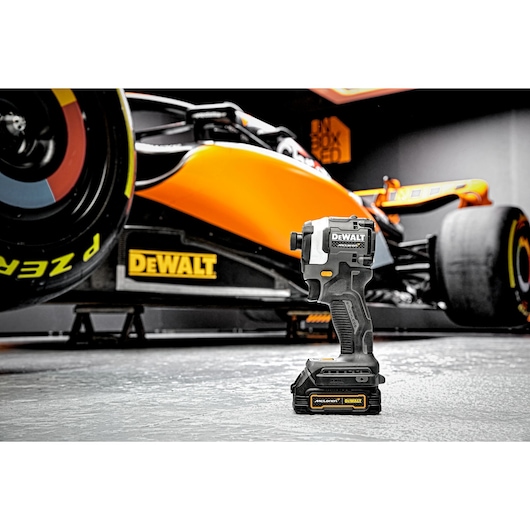 Limited Editon DEWALT/McLaren Impact Driver with McLaren F1 car in the background