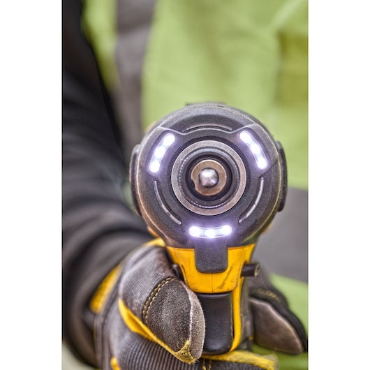 Front on, close view of DCF870 18V XR Brushless impact driver. Tool work lights are illuminated