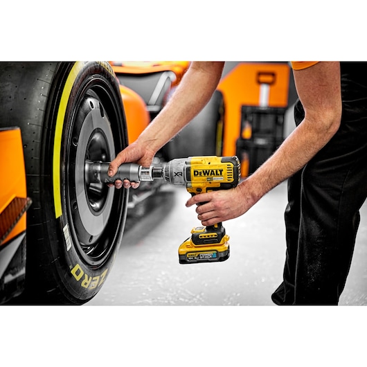 Dewalt 18V XR Brushless 1/2" Hog Ring High Torque Impact Wrench being used on McLaren F1 car wheel