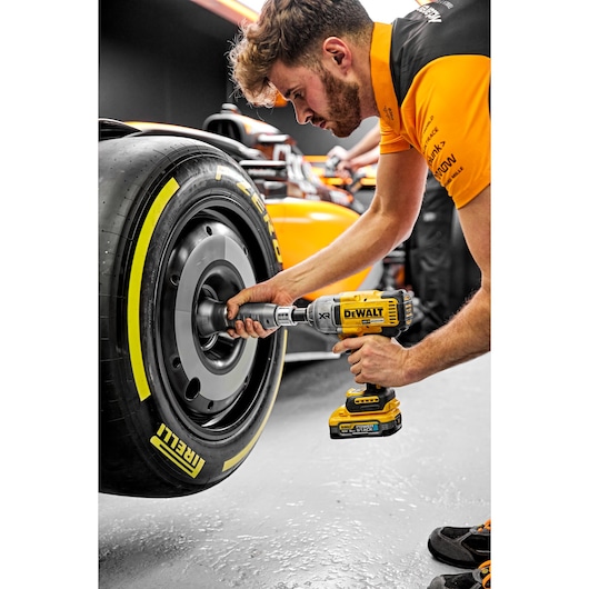 McLaren pit crew using Dewalt 18V XR Brushless 1/2" Hog Ring High Torque Impact Wrench being used on McLaren F1 car wheel