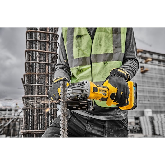 18V XR Brushless 125mm Grinder 3/4 right side grinding metal on work site