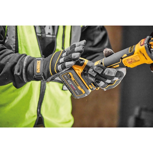 Flexvolt battery being connected to Brushless 18V XR 125mm cordless angle grinder