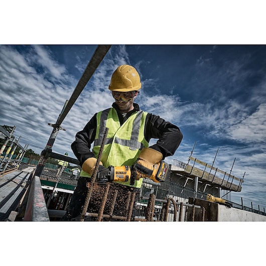 6 INCH CORDLESS GRINDER WITH KICKBACK BRAKE being used by a workman on a work site