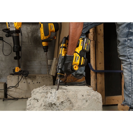 54V XR FLEXVOLT 30mm SDS-Plus Hammer Drill on top of concrete block 
