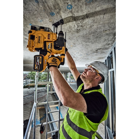 54V FlexVolt Brushless SDS Hammer Drill and Dust Extractor drilling concrete ceiling