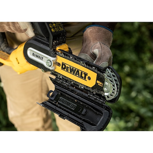 Open safety guard on an 18V XR Brushless Chain Saw