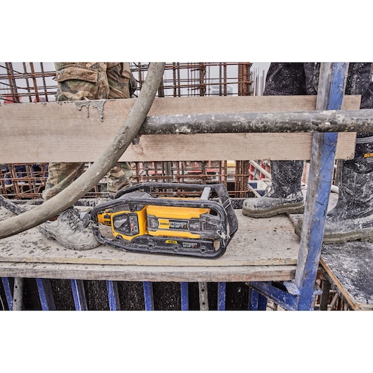 Close view of Powershift Powerpack Concrete Vibrator and hose in use on a construction site