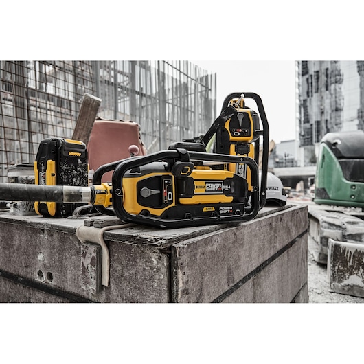 x2 Powershift Powerpack Concrete Vibrators and x1 Powershift battery DCBPS0554 on a construction site