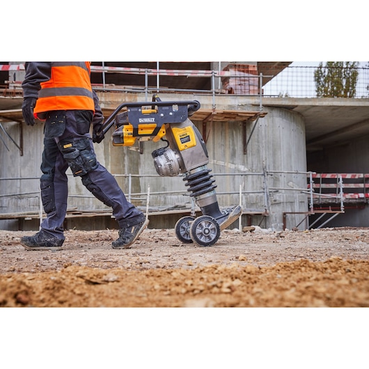 Powershift Rammer with wheels being transported across construction site
