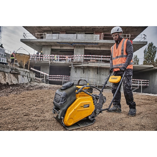 Construction worker uses Powershift Plate Compactor