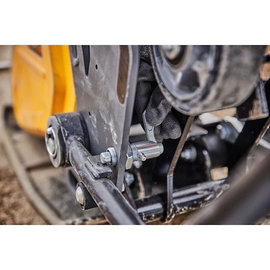 Worker adjusts Powershift Plate Compactor