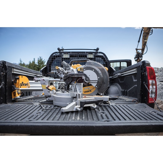 The DEWALT 18V XR 305mm Slide Mitre Saw in back of works truck