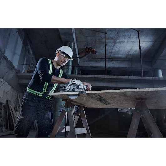 Corded Circular Saw Cutting Wood Showing Saw Blade from Below