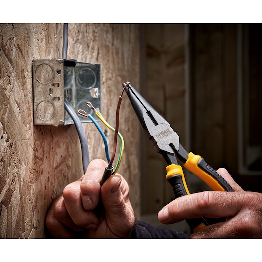 DEWALT 8" LH Long Nose 200mm plier being used to bend copper wire"