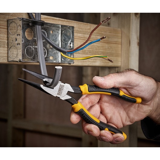 DEWALT 8" LH Long Nose 200mm plier being used to cut cable on socket"