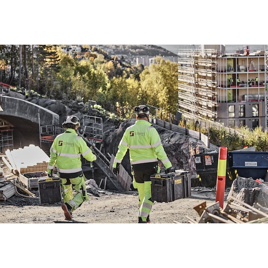 TOUGHSYSTEM 2.0 - DS400 carried to worksite by two construction workers